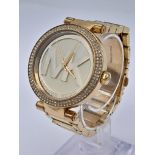 A Michael Kors Gold Plated Ladies Dress Watch. Gold plated bracelet and case - 38mm. MK gilded dial.
