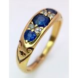 A 18K YELLOW GOLD DIMAOND & SAPPHIRE RING. TOTAL WEIGHT 3.4G. SIZE M