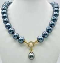 A Metallic Grey South Sea Pearl Shell Necklace with a Teardrop Pendant. 14mm large beads. Gilded