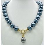 A Metallic Grey South Sea Pearl Shell Necklace with a Teardrop Pendant. 14mm large beads. Gilded