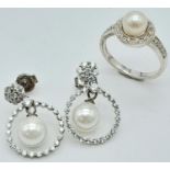 A STERLING SILVER STONE SET RING & EARRING SET. 7.6G SIZE N