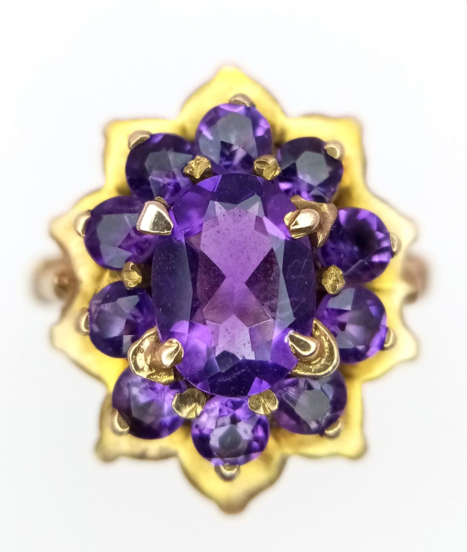 A Vintage 9K Yellow Gold Amethyst Ring. Central oval cut amethyst with an amethyst halo. Size M. 4. - Image 2 of 4