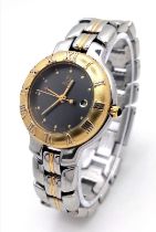 A Ladies Fendi Two-Tone Quartz Watch. Two-tone bracelet and case - 32mm. Black dial with date