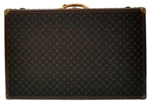 A Louis Vuitton Alzer 80 Monogram Large Sturdy Suitcase/Trunk. Monogram canvas and brown leather