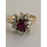 14 carat YELLOW GOLD,DIAMOND and RUBY RING. Having an oval cut Ruby to centre with full Diamond