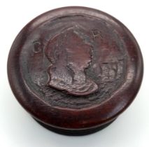 A HAND CARVED GEORGIAN TRINKET BOX DATED 1797 AND WITH THE PROFILE OF GEORGE III ON THE TOP .