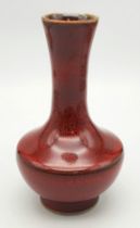 A Chinese Iron-Rust Glazed Bottle Vase. Covered all over in a reddish-brown glaze speckled with