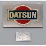 A STERLING SILVER DATSUN NIPPON PLAQUE, PLUS MINI SILVER PLAQUE FOR THE CAR. 25g total weight.