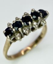A Classic Vintage Sapphire and Diamond Ring. Five sapphires between four two rows of diamonds.