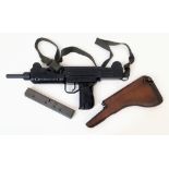 A Deactivated Uzi 9mm Sub-Machine Gun. Nice condition with: Removable magazine, wood stock, sling