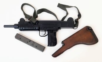 A Deactivated Uzi 9mm Sub-Machine Gun. Nice condition with: Removable magazine, wood stock, sling