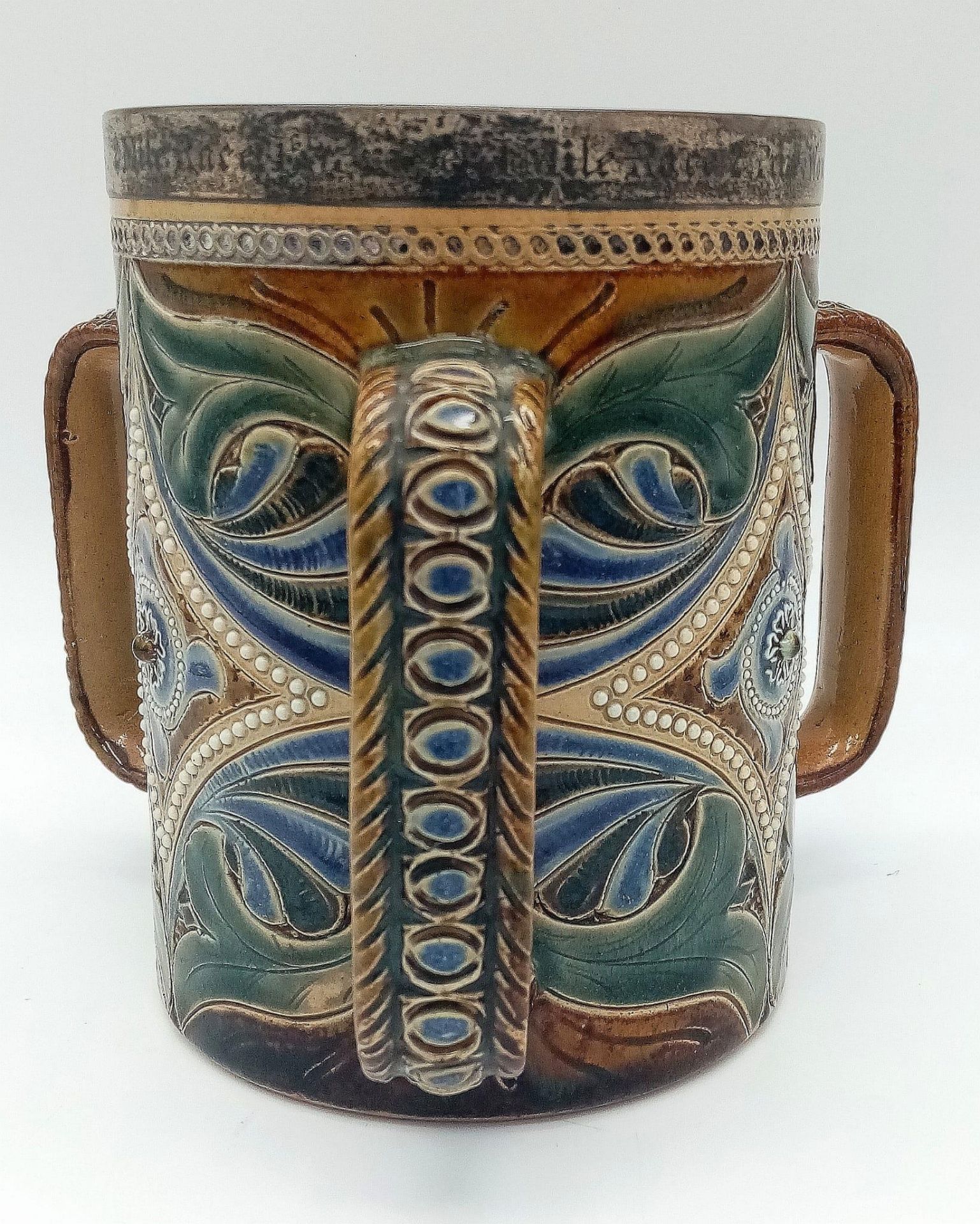 A Doulton Lambeth Three-Handled Salt Glazed Large Mug. Hallmarked silver band at rim. Inscription of - Bild 2 aus 4