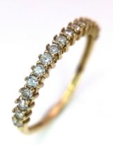 An 18K Yellow Gold Diamond Half Eternity Ring. Size N. 1.32g total weight.