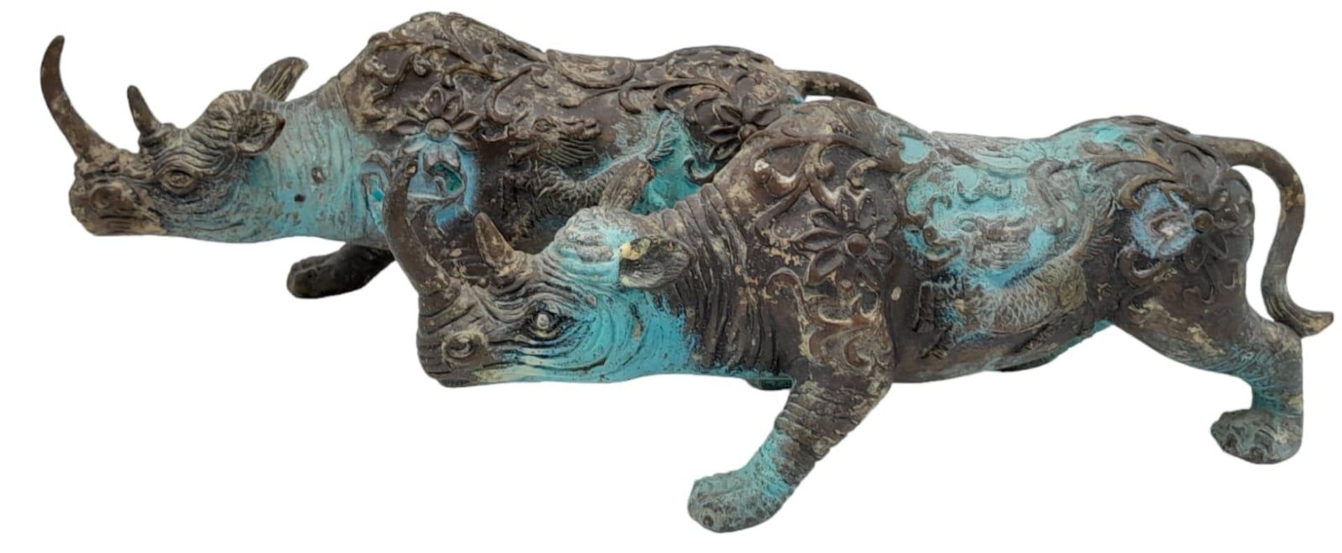 A PAIR OF VERY EARLY ANTIQUE CHINESE BRONZE WARE CEREMONIAL RHINOCEROSES WITH DRAGON ON FLANKS, - Image 3 of 8