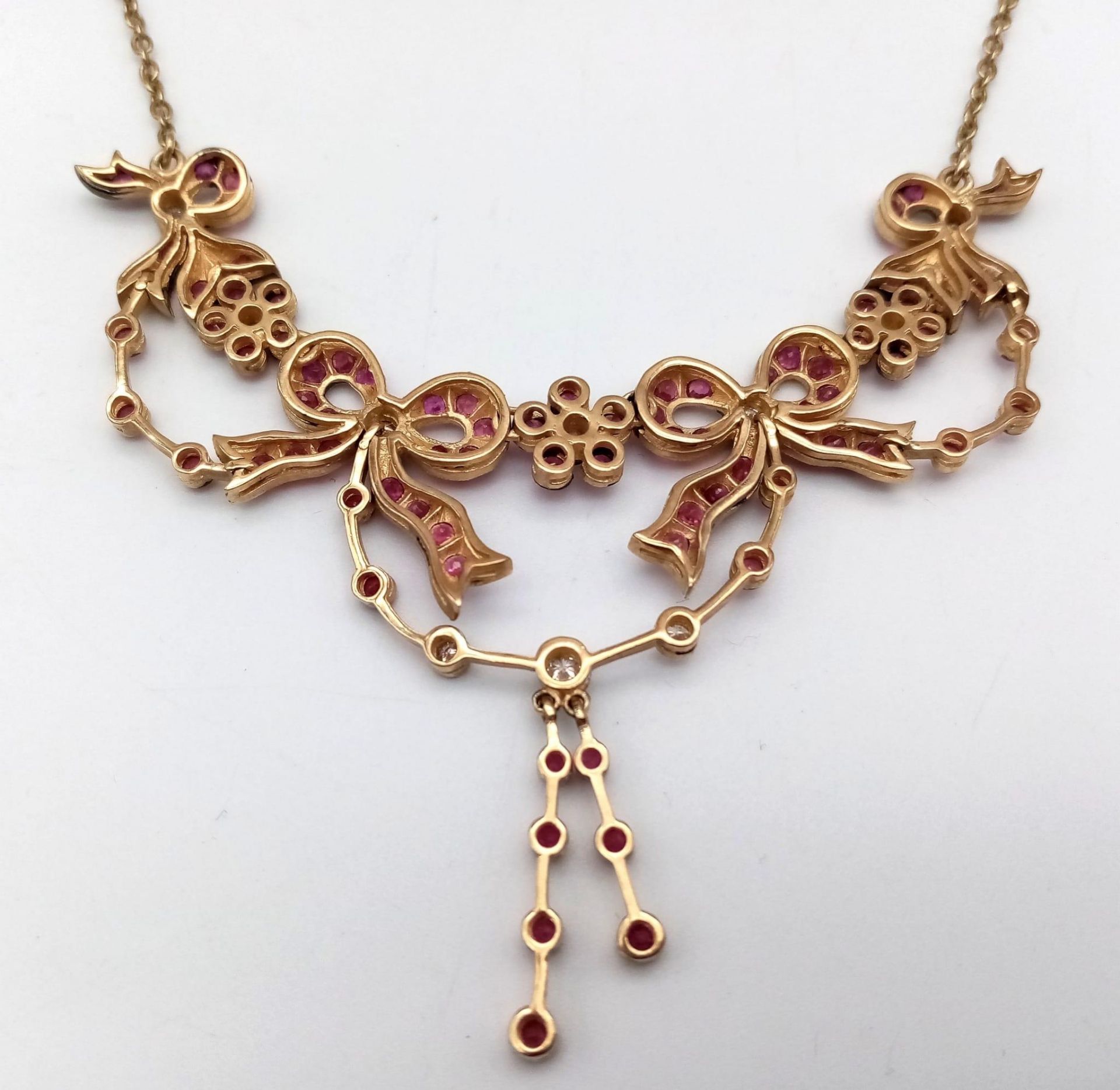 An Art Deco Style 9K Yellow Gold Ruby and Diamond Lavaliere Necklace. Floral and bow decoration. - Image 5 of 7