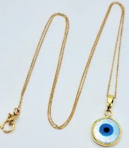 An Evil Eye 18k Gold Pendant on an 18K Gold Disappearing Necklace. 20mm and 44cm. 1.85g total