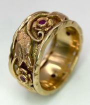 A Beautifully Decorated Bird and Floral 14K Rose Gold and Ruby Band Ring. Size N. 7.5g total weight.