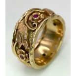 A Beautifully Decorated Bird and Floral 14K Rose Gold and Ruby Band Ring. Size N. 7.5g total weight.