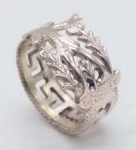 AN INTERESTING STERLING SILVER RING, RECYCLED FROM A SPOON HANDLE MARKED 'CRETE'. WEIGHT 5.4G,