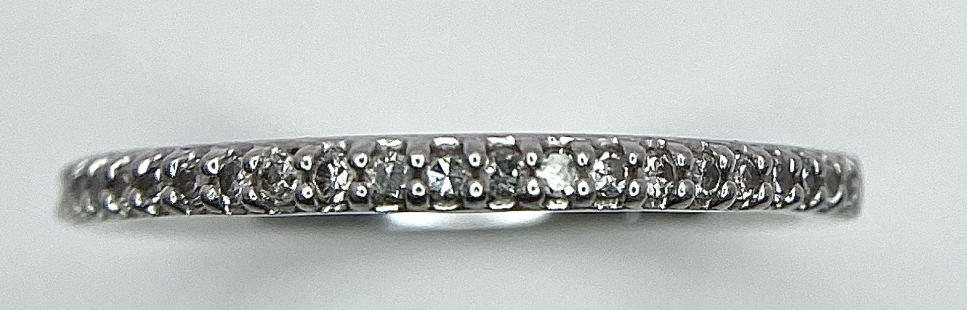 A 950 PLATINUM DIAMOND SET BAND RING. TOTAL WEIGHT 2.5G. SIZE K - Image 4 of 6