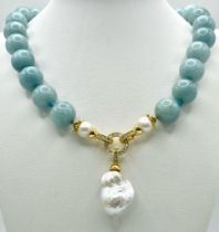 A Fabulous Blue Aquamarine and Baroque Pearl Necklace. 14mm aquamarine beads give way to an