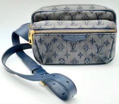 A LOUIS VUITTON OVERSIZED "FANNY PACK" IN BLUE LIVERY WITH THE LV LOGO AND PRINT , A FEW USAGE MARKS