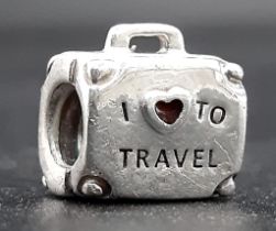 A PANDORA STERLING SILVER SUITCASE CHARM, ENGRAVING "I LOVE TO TRAVEL" 3.7G ref: SC 3146