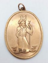 A 9K GOLD VINTAGE ST CHRISTOPHER PENDANT IN AN ATTRACTIVE OVAL SHAPE . 9.7gms 3cms drop