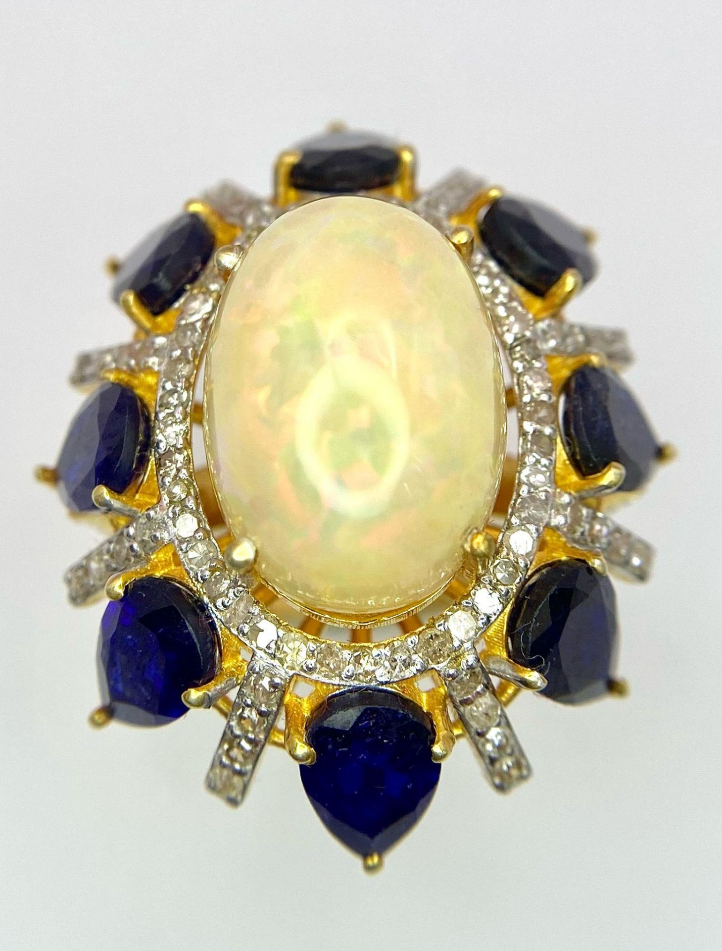 A Head-Turning Opal, Tanzanite and Diamond Ring. Centre 7ct colour-play opal with a tanzanite and - Image 3 of 6