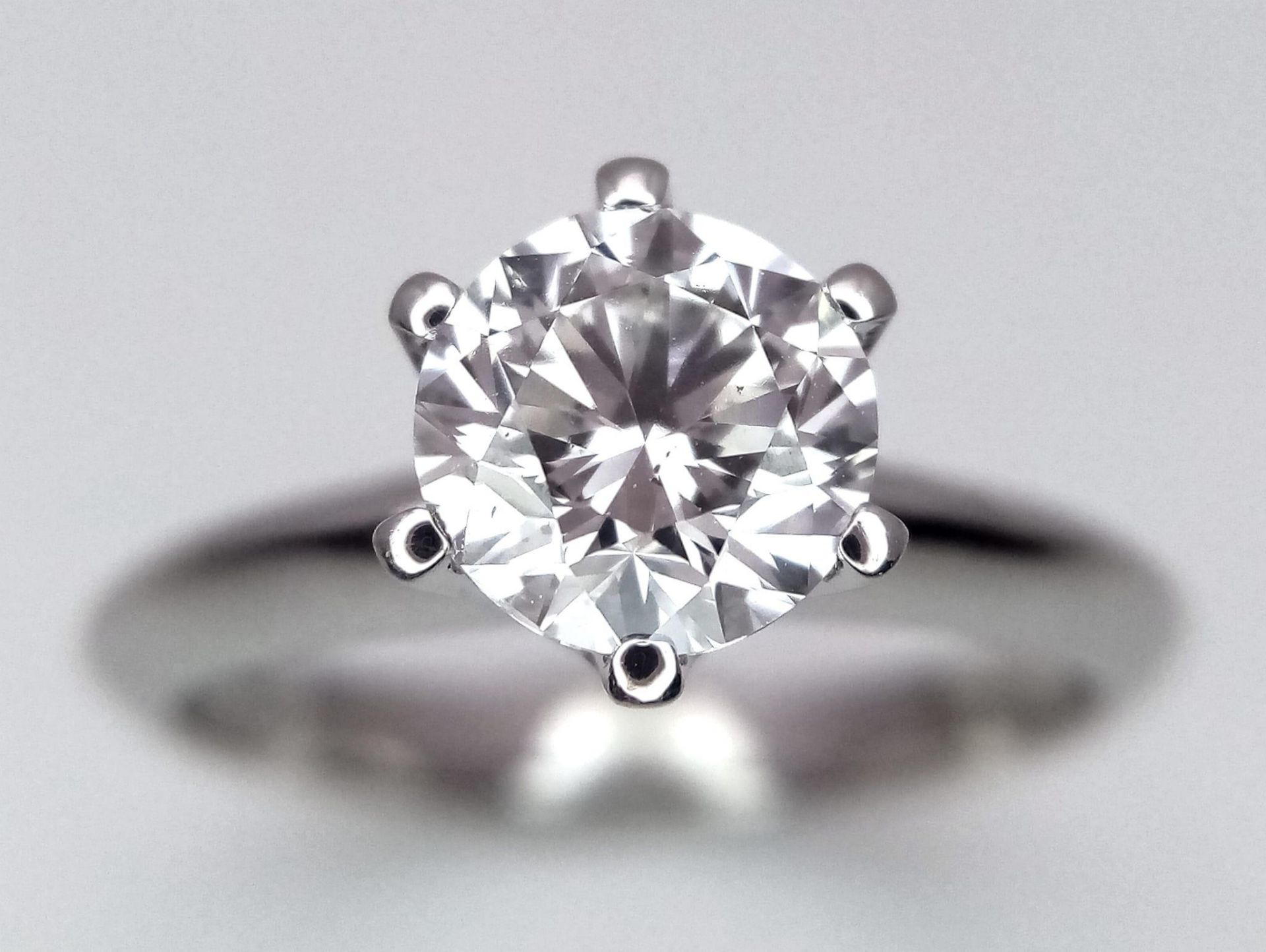 An 18K white Gold 1ct Diamond Solitaire Ring. Brilliant round cut diamond. Comes with an IGI