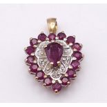 A 9K YELLOW GOLD DIAMOND & RUBY HEART PENDANT. TOTAL WEIGHT 2G