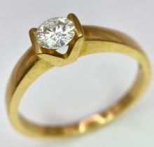 A Vintage 18K Yellow Gold Diamond Solitaire Ring. 0.70ct brilliant round cut diamond. Size S. 4.