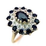 A 9K YELLOW GOLD DIAMOND & SAPPHIRE CLUSTER RING. TOTAL WEIGHT 2.8G. SIZE L