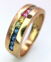 A 9K Yellow Gold Multi-Gemstone Band Ring. Includes sapphires and diamonds. Size L. 3.05g weight.