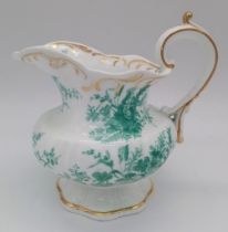 AN ETRUSCAN SHAPED SMALL FOOTED JUG WITH FLORAL PRINT AND GILT TRIM . 15 X 13cms