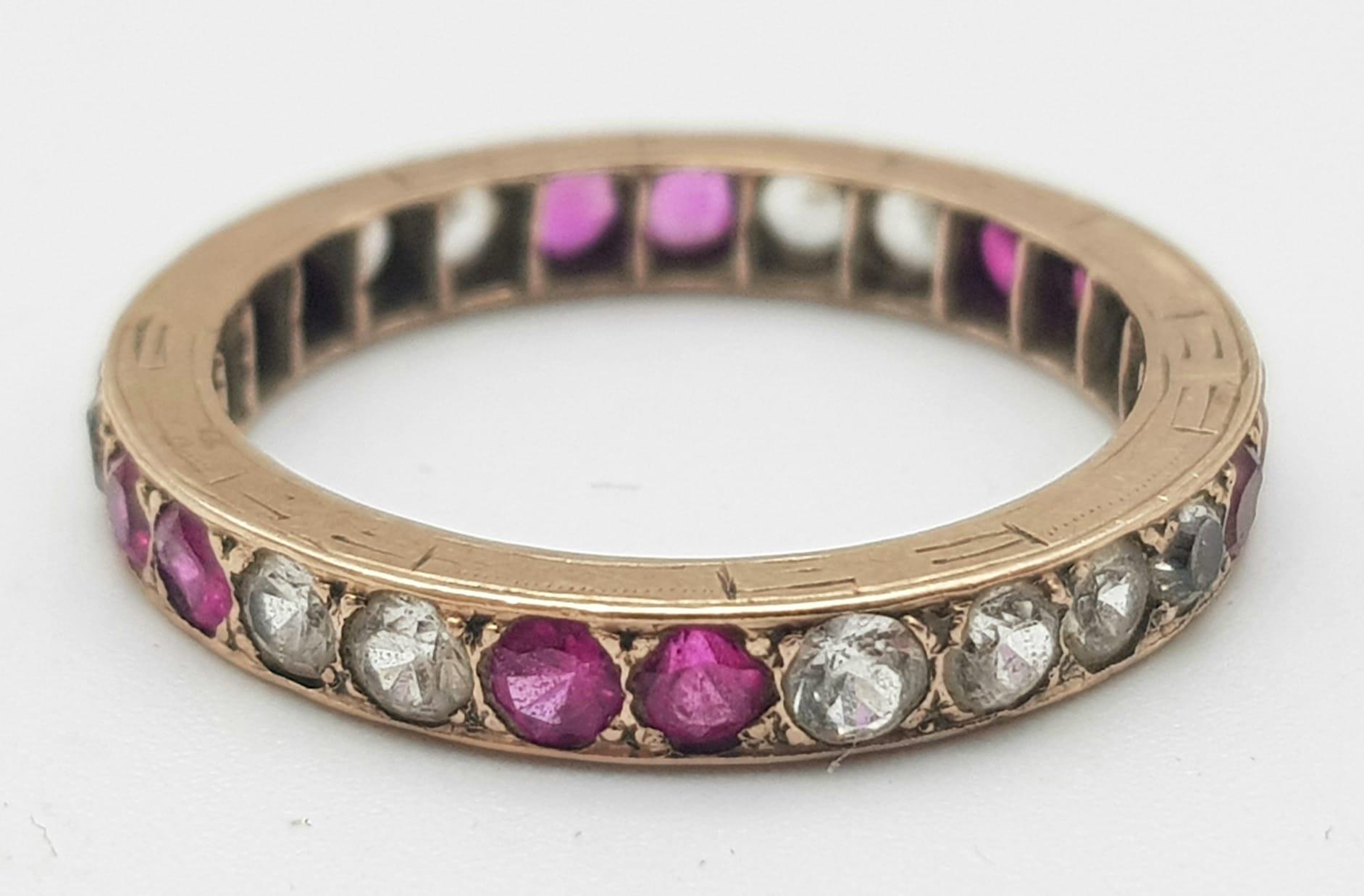 A 9K GOLD FULL ETERNITY RING WITH PINK RUBY AND WHITE SAPPHIRES , 2.1gms size N - Image 2 of 3