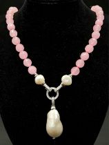 A Very Different Pink Jade and White Keisha Baroque Pearl Necklace. 10mm jade beads give way to an