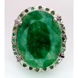 An Emerald Oval Cut 925 Silver Ring with an Emerald Halo. 45ctw. W-15.20g. Size Q. Comes with a