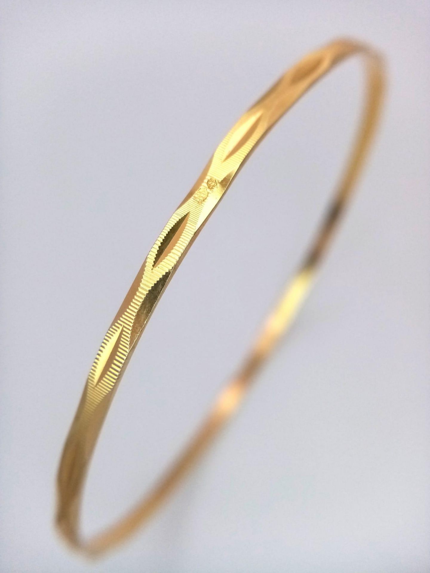 A 9K Yellow Gold Thin Bangle. 3mm width. 6.5cm inner diameter. 5.75g weight. - Image 2 of 4