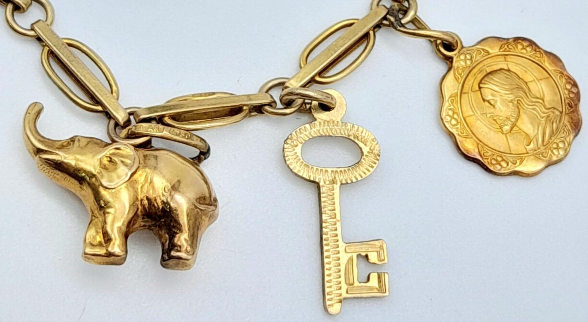 A 9K Yellow Gold Charm Bracelet. Eight charms including Elephant! 10.65g weight. - Image 3 of 6