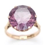 A 14K ROSE GOLD RING WITH ALEXANDRITE COLOURED STONE . 2.9gms size N