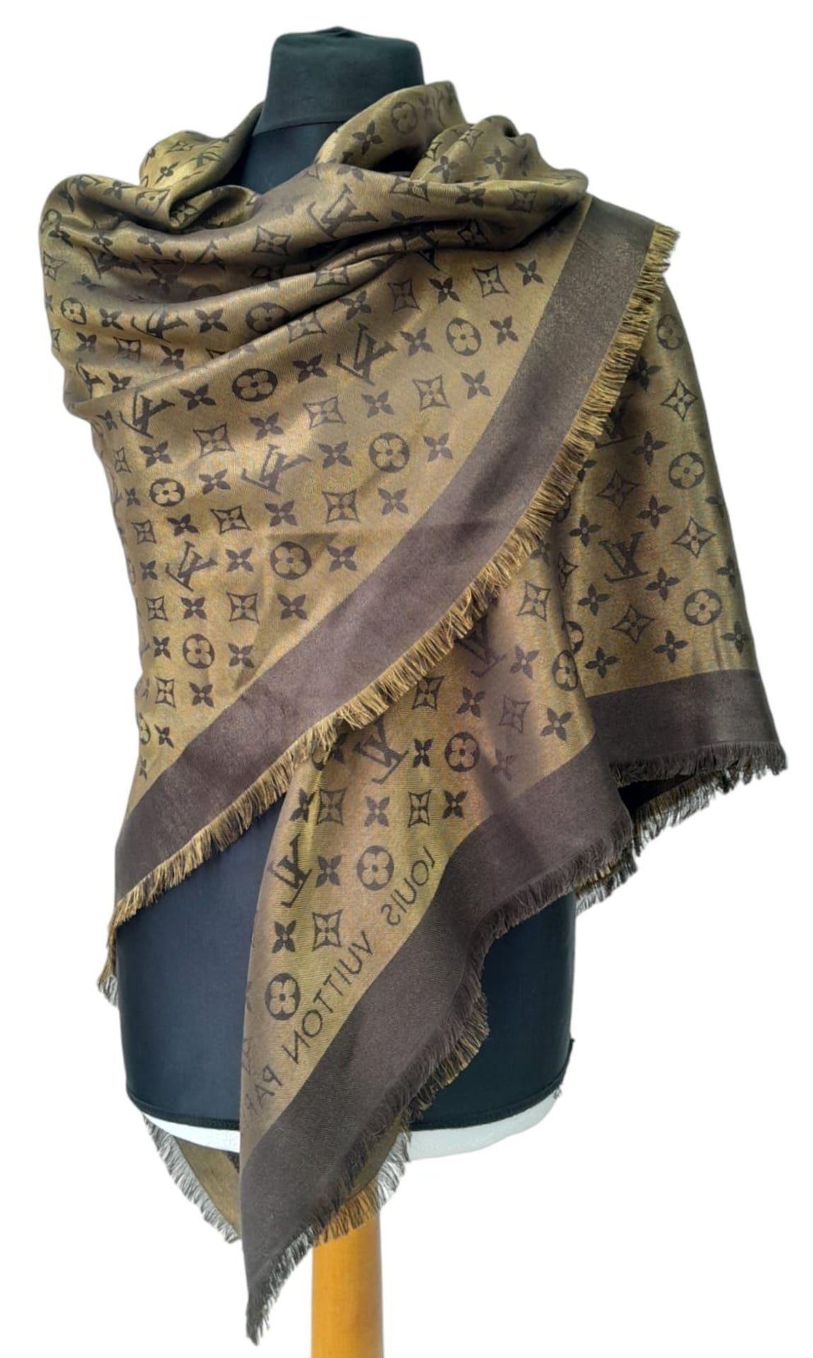 A Louis Vuitton Châle Monogram Shine Silk Scarf. Comes with purchase receipt. Approximately 140cm