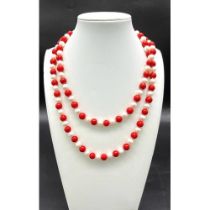 A Matinee Length Red Coral and Cultured Pearl Necklace. 7/8mm pearls and beads. 88cm length.