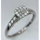 A 9K WHITE GOLD 0.40CT DIAMOND CLUSTER RING. TOTAL WEIGHT 2.3G. SIZE U