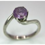 A vintage 925 silver Amethyst crossover ring. Total weight 3.25G. Size O.