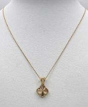An 18K Yellow Gold Clover Pendant on an 18K Yellow Gold Disappearing Necklace. 15mm and 42cm. 2.
