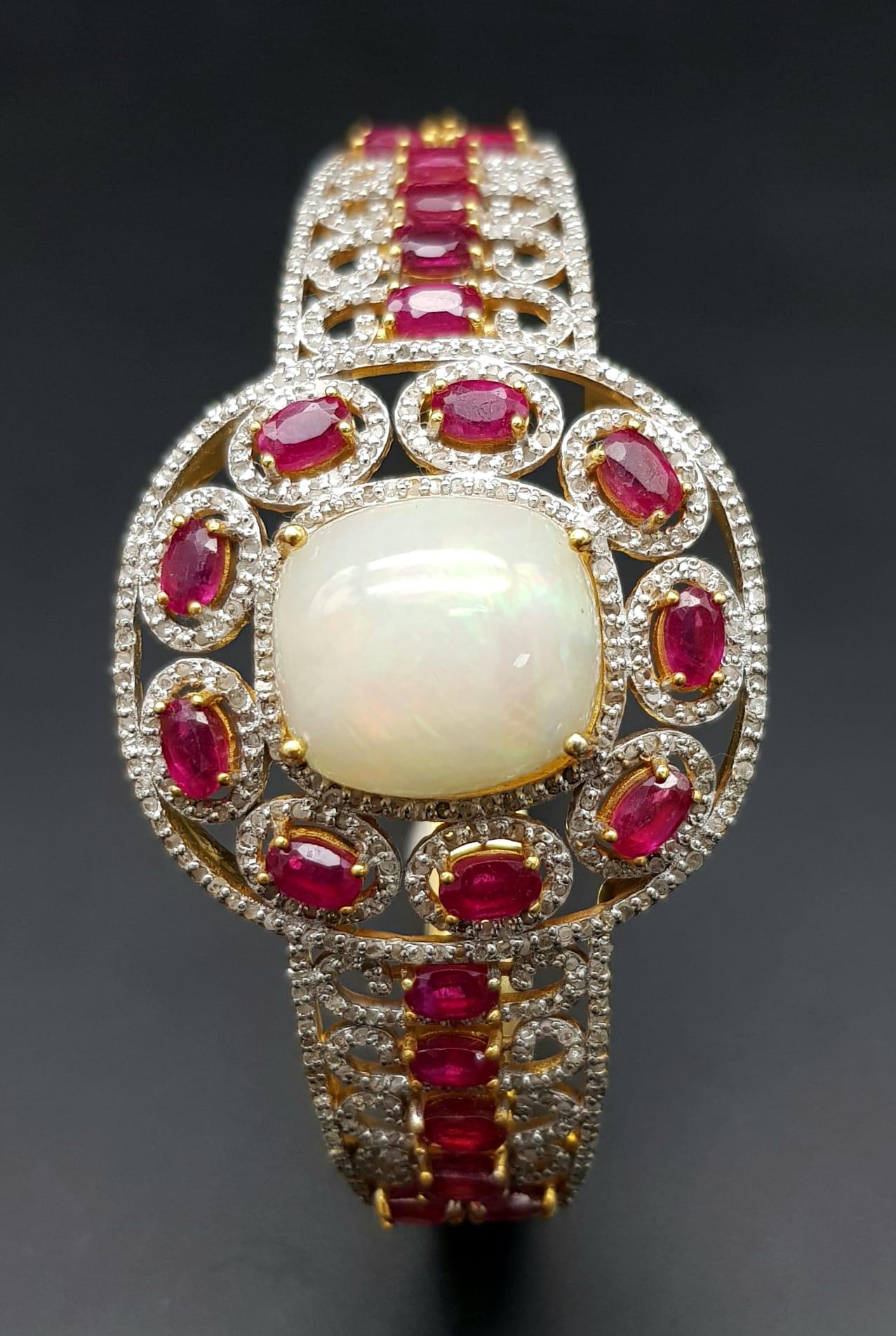 A Wonderful Majestic Colour-Play 12ct Opal and Ruby Gemstone Cuff Bracelet with Diamond Accents. - Image 3 of 6