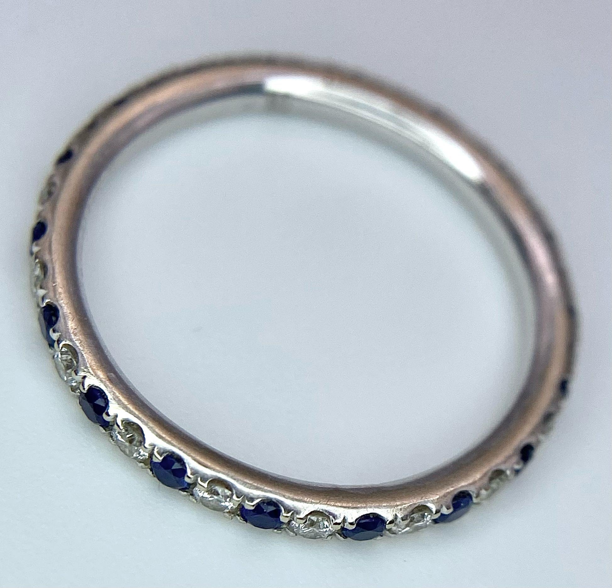 A 14ct white gold diamond and sapphire full eternity ring set with 18 diamonds and 18 sapphires, 1. - Image 4 of 5