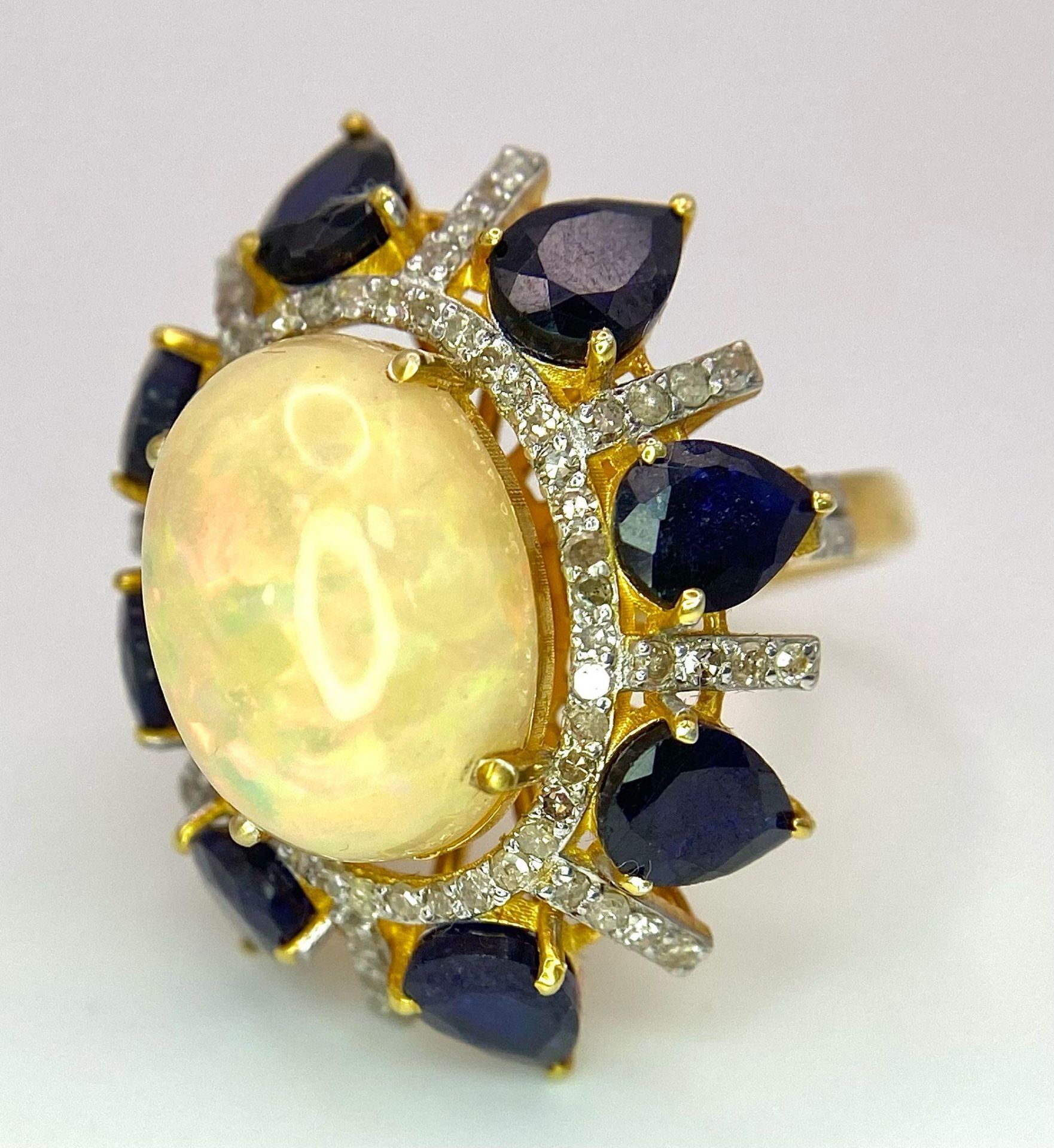 A Head-Turning Opal, Tanzanite and Diamond Ring. Centre 7ct colour-play opal with a tanzanite and - Image 4 of 6