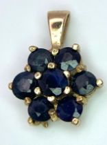 A 9K YELLOW GOLD BLUE STONE SET PENDANT. TOTAL WEIGHT 1.1G